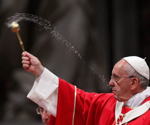 Pope flicking holy water from an aspergillum